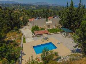 an aerial view of a villa with a swimming pool at Sea View Villa Giorgios Five Bedroom in Gavalochori