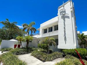a white building with a cross on the side of it at Royal Palms Resort & Spa in Fort Lauderdale