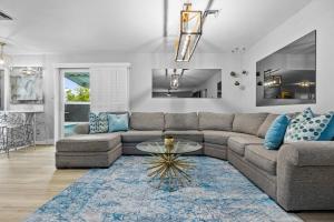 a living room with a couch and a table at 4bdrm 2 Bath Pool Close To Strip Conventions in Las Vegas