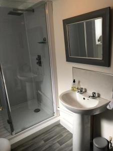 a bathroom with a sink and a shower at 29a Margate in Kent