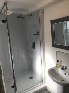 a bathroom with a shower and a sink at 29a Margate in Kent