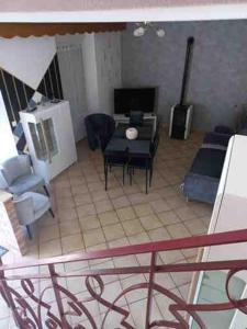 a view of a living room with a table and chairs at gite St anne in Fresnes-en-Woëvre