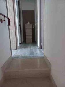 a hallway with a door leading into a room at gite St anne in Fresnes-en-Woëvre