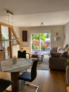 a living room with a couch and a table at Ferienwohnung Müller in Stendal