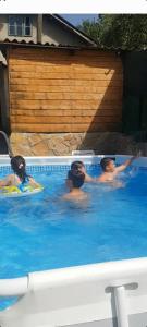 a group of people swimming in a swimming pool at Vista Sarajevo Old Town in Sarajevo