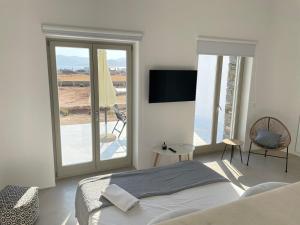 Postel nebo postele na pokoji v ubytování CAMPO SUITES