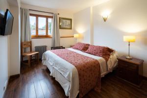 Postel nebo postele na pokoji v ubytování Tunqueley Hotel