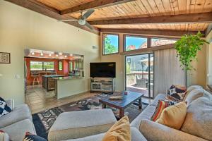a living room with two couches and a tv at Sunny Sedona Retreat with Scenic Red Rock Views in Sedona