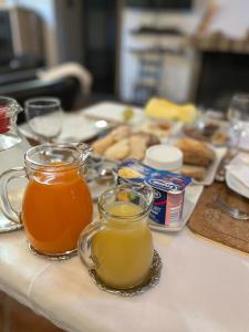 two cups of tea on a kitchen counter with food at B&B Charme Sa Pardina in Orroli