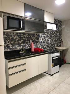 A cozinha ou cozinha compacta de Apartamento aconchegante no Bessa