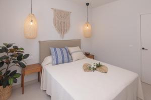 Łóżko lub łóżka w pokoju w obiekcie Villa Eden Beachfront Corralejo By Holidays Home