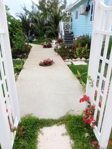 a walkway leading to a house at 5 Bay's of Pirates Bahamas Great Harbour Cay, Bahamas in Bullocks Harbour