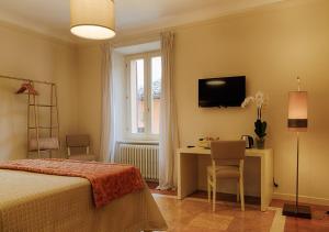 Ένα ή περισσότερα κρεβάτια σε δωμάτιο στο Il Cortile Segreto