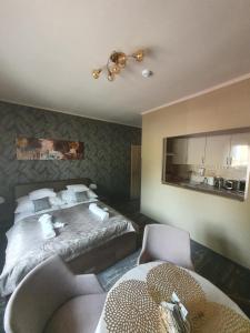 Posteľ alebo postele v izbe v ubytovaní Harmony apartments
