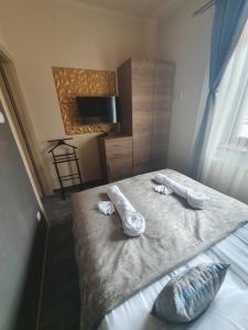 Posteľ alebo postele v izbe v ubytovaní Harmony apartments