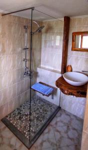 a bathroom with a shower and a sink at Casa Qeparo in Qeparo