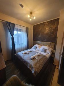 Posteľ alebo postele v izbe v ubytovaní Harmony apartments