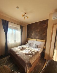 Posteľ alebo postele v izbe v ubytovaní Harmony apartments