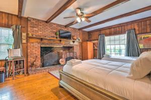 a bedroom with a large bed and a fireplace at Spacious Memphis Home Less Than 3 Mi to Graceland! in Memphis