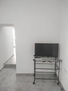 Televízia a/alebo spoločenská miestnosť v ubytovaní Casa Alba 1
