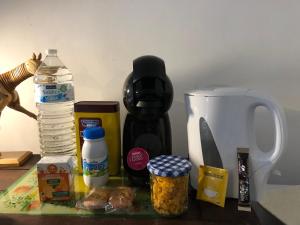 a counter top with food ingredients and a knife at Ancien hôtel aux moines Pierrefitte St Lo in Saint Lo