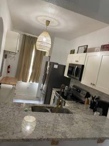 a kitchen with a sink and a counter top at Serene family friendly townhouse in the wonderful Regal Palms in Davenport