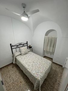 Łóżko lub łóżka w pokoju w obiekcie Casa Villanueva de Córdoba