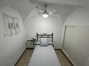Łóżko lub łóżka w pokoju w obiekcie Casa Villanueva de Córdoba