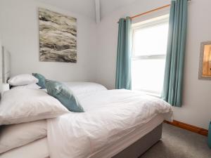 a bedroom with two beds and a window at The Sun Terrace in Chester