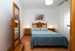 Ένα ή περισσότερα κρεβάτια σε δωμάτιο στο Casa Sagrario