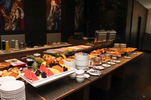 a buffet with many different types of food on a table at Manaus Hotéis Millennium in Manaus