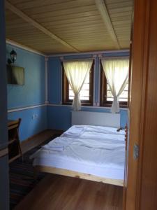 Postel nebo postele na pokoji v ubytování Недкова къща