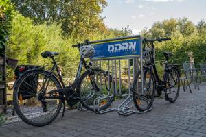 a group of bikes parked next to a sign at Hotel Garni FairSchlafen in Minden