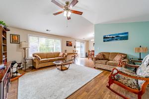 a living room with couches and a ceiling fan at Serenity By The Sea in McKinleyville