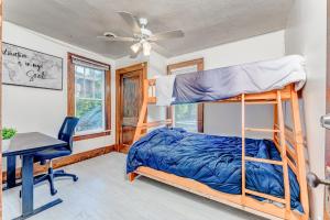 a bedroom with a bunk bed and a desk at Awesome House, 5 minutes to DT, 2 miles to Stadium and Ruby Memorial! in Morgantown