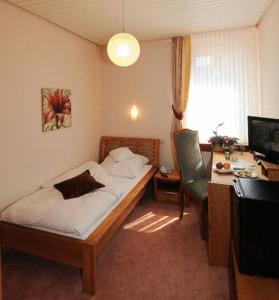 Postel nebo postele na pokoji v ubytování Hotel Brielhof
