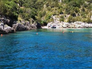a river with blue water and a rocky coastline at B&b Anna's home in Marina di Camerota