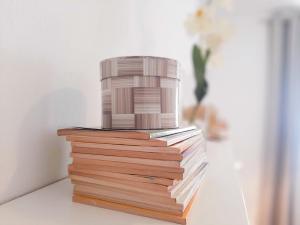 a stack of books with a cake on top of it at Casa Los Titos in Arriate