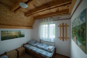 Ліжко або ліжка в номері Holiday Mokro