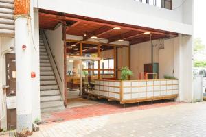 an entrance to a building with a restaurant at fan! -ABURATSU- Sports Bar ＆ HOSTEL in Nichinan