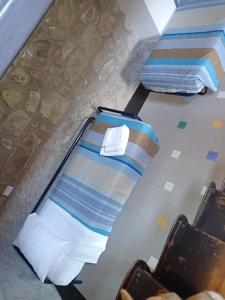 Ένα ή περισσότερα κρεβάτια σε δωμάτιο στο La Torre