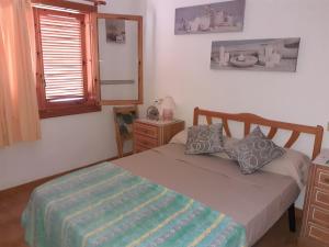 Llit o llits en una habitació de Vacaciones en playa del Tamarit