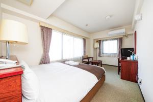 Postel nebo postele na pokoji v ubytování Sky Heart Hotel Koiwa