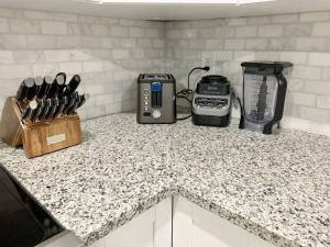 a kitchen counter with a toaster and a blender on it at Home in West Palm Beach with Heated Pool in West Palm Beach