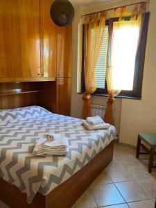 Postel nebo postele na pokoji v ubytování Casa di Paola mare Ardea + 18 fotografií