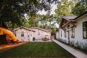 a backyard with a slide and a playground at Sacramento Guest House with Patio about 5 Mi to Downtown in Sacramento