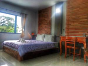 Cama ou camas em um quarto em Lanta Manta Apartment