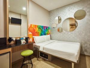 Postel nebo postele na pokoji v ubytování ibis budget Singapore Clarke Quay