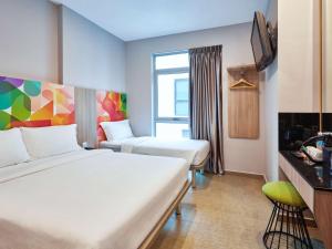 Postel nebo postele na pokoji v ubytování ibis budget Singapore Clarke Quay