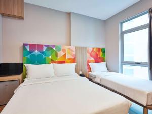 Postel nebo postele na pokoji v ubytování ibis budget Singapore Clarke Quay